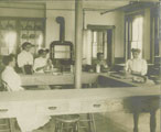 "Practice Kitchen, Hartshorn Memorial College - Teacher, Miss Belle J. Clark, Students, Marie Waller, Ursila Thomas, Annie Johnson." Virginia Union University Archives. Date: 1909-1910.