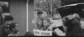 Law enforcement officers with students at Hartwood Elementary School, Stafford County
				 Date: Undated Collection: 2000031P24, Central Rappahannock Heritage Center.