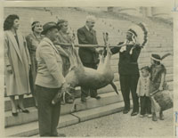 Photograph of Gov. Almond receiving tribute from Chief Tecumseh D. Cook