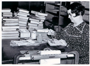 A WPA worker binding books