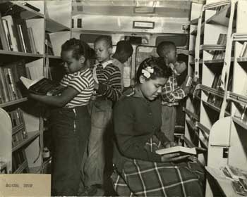 Pictures of boys and girls on the Orange County Public Library Bookmobile