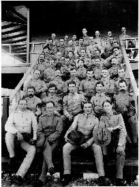 The detachment of the Hospital Corps, Camp Columbia, Cuba, pose on the Camp Columbia Hospital steps. Volunteers from this group served in Walter Reed's groundbreaking yellow fever experiments of 1900-1901, which demonstrated that the mosquito (aedes aegypti) was the vector for the spread of yellow fever.
