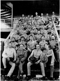 The detachment of the Hospital Corps, Camp Columbia, Cuba, pose on the Camp Columbia Hospital steps. Volunteers from this group served in Walter Reed's groundbreaking yellow fever experiments of 1900-1901, which demonstrated that the mosquito (aedes aegypti) was the vector for the spread of yellow fever.