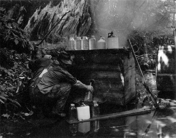 Ted "Thumpkeg" Dehart Brewing Up A Little Liquor, n.d.