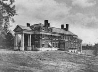 Image of the old hospital in 1901. Date: 1901. Citation: Historical Collections & Services, Claude Moore Health Sciences Library, University of Virginia.