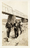 Three men with Chain Bridge in the background. Date:  ca. 1930.