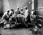 Doctors preparing for surgery. Date: 1913.