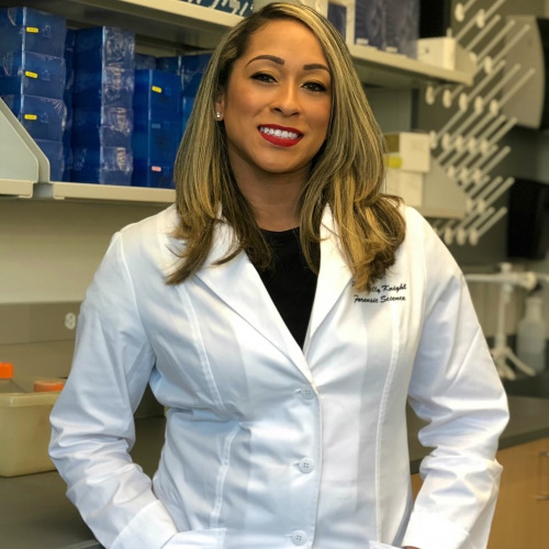 African American woman wearing a white lab coat