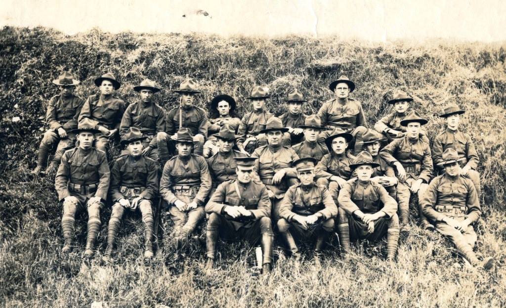 Image of soldiers sitting in a field
