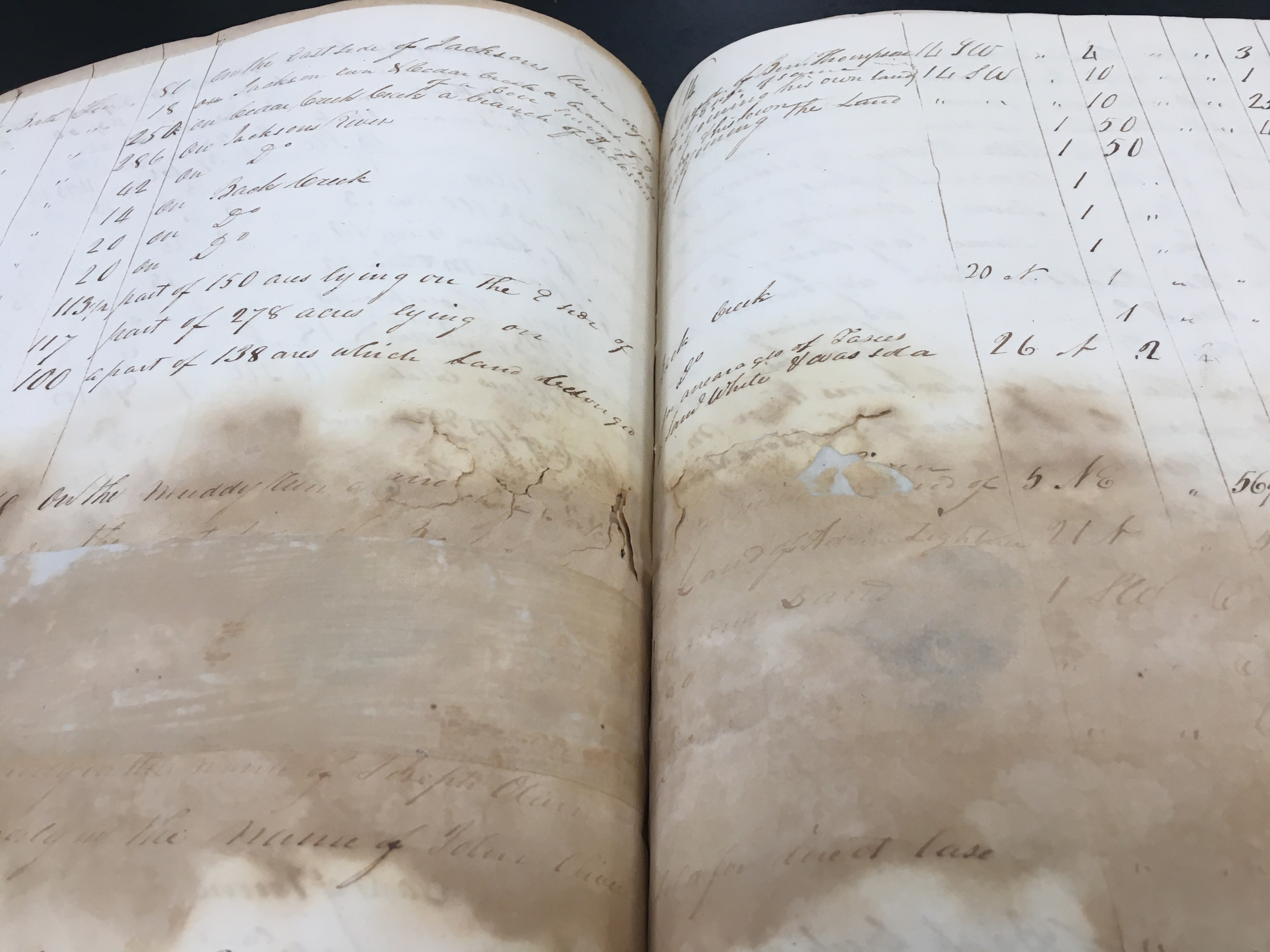 group of people standing on large staircase smiling 