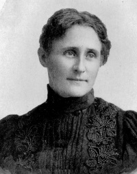 headshot of a white woman in late 19th century attire