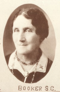 Headshot of a white woman in 1920s era attire