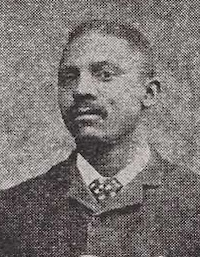 African American man with a mustache wearing late 19th century attire.
