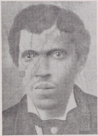 African American man with a mustache wearing late 19th century attire.