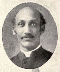 African American man wearing a clerical collar.