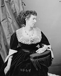 Profile photograph of a white woman wearing 19th century attire.