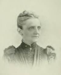 Headshot of a white woman in 19th century attire.