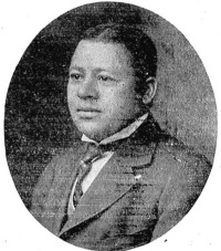 Headshot of an African American man wearing early 20th century attire.