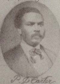 African American man with a mustache wearing late 19th century attire.