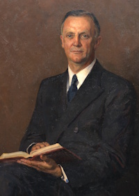 Oil portrait of a white man wearing mid-20th century attire while seated and holding a book.