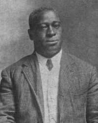 African American man wearing early 20th century attire.