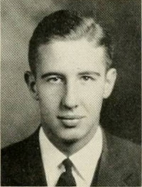 Yearbook photo of a young white man in a suit and tie.