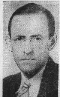 Newspaper photograph of a white man wearing glasses and a suit and tie.