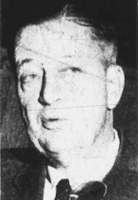 Newspaper photograph of a white man wearing mid-20th century attire.