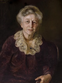 OIl portrait of a white woman wearing a dark dress with a lace collar.