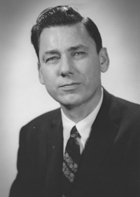 White man wearing late 20th century attire.