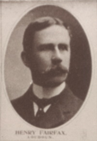 Headshot of a white man with a mustache wearing early 20th century attire.