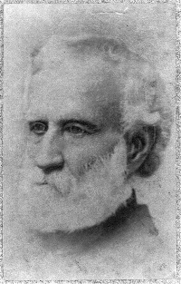 Headshot of a white man with a beard.