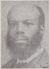 African American man with a beard and mustache wearing late 19th century attire.