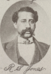 African American man with a mustache wearing late 19th century attire.