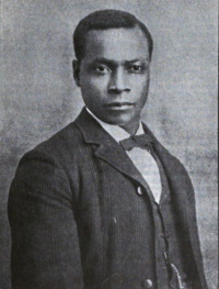 An African American man wearing a late 19th century suit.