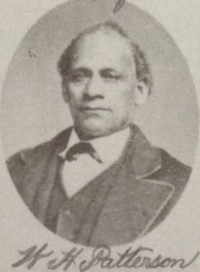 Headshot of an African American man wearing late 19th century attire.