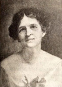 Photograph of a portrait of a white woman wearing early 20th century attire.