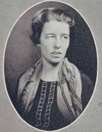 White woman wearing early 20th century attire.