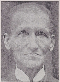 Headshot of an African American man wearing late 19th century attire.
