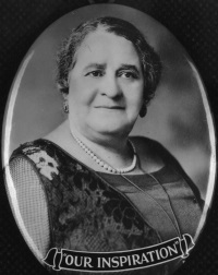 Headshot of an African American woman wearing early 20th century attire with the words Our Inspiration beneath her photograph.