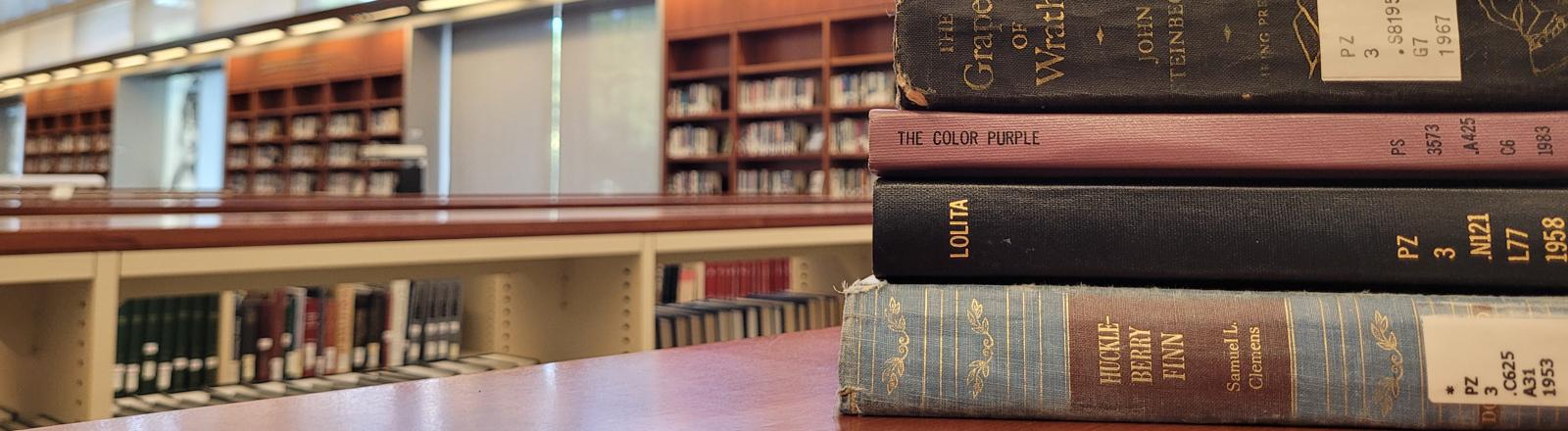 Stacked books in library.