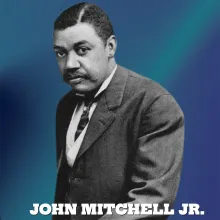 Black and white photograph of John Mitchell, Jr. on a blue background