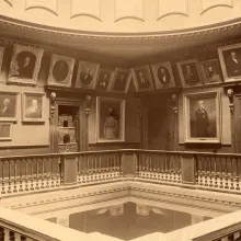 View of portraits hanging on the third floor gallery at the Virginia State Capitol.